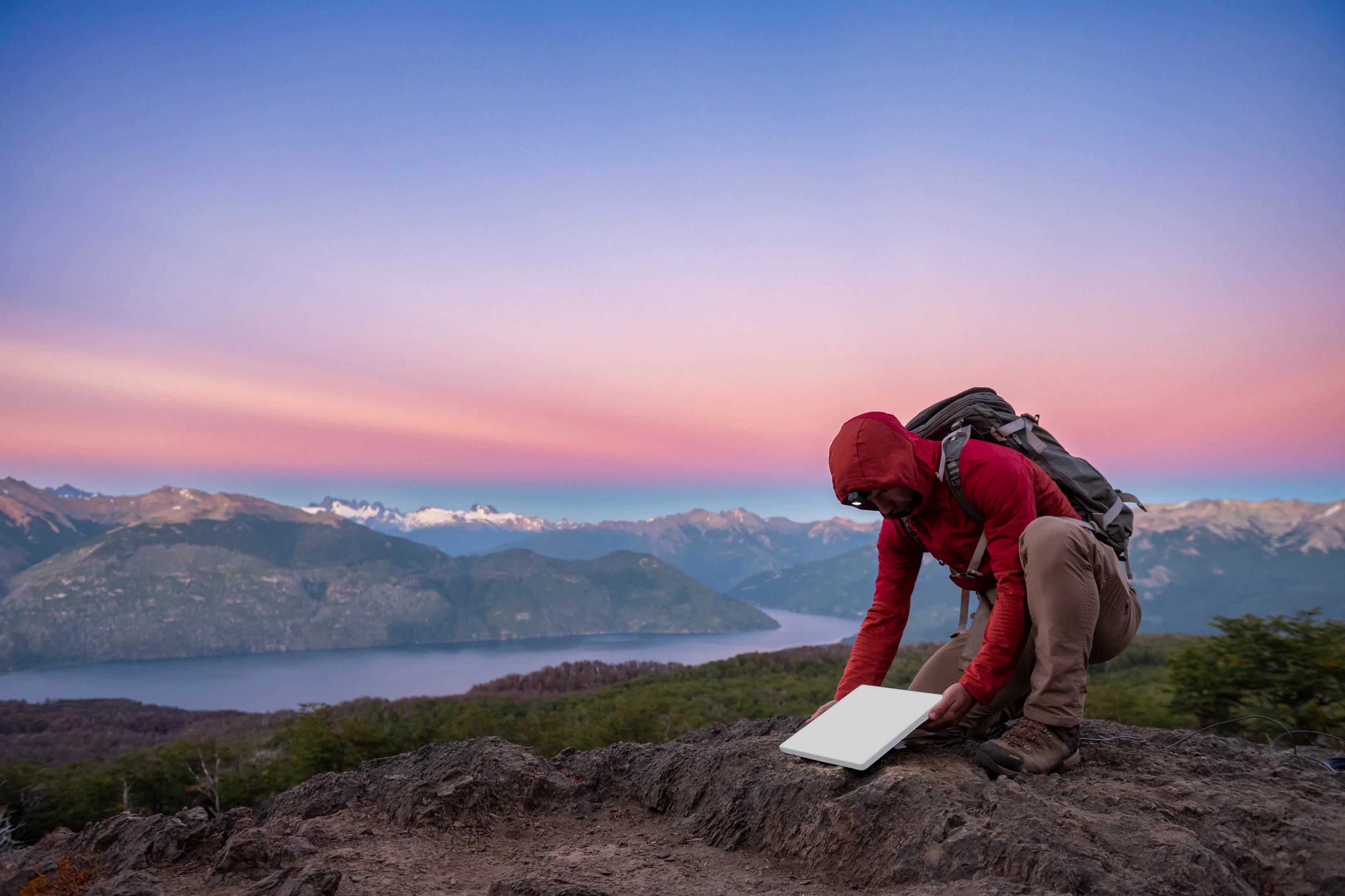mini_backpacker_on_mountain.webp